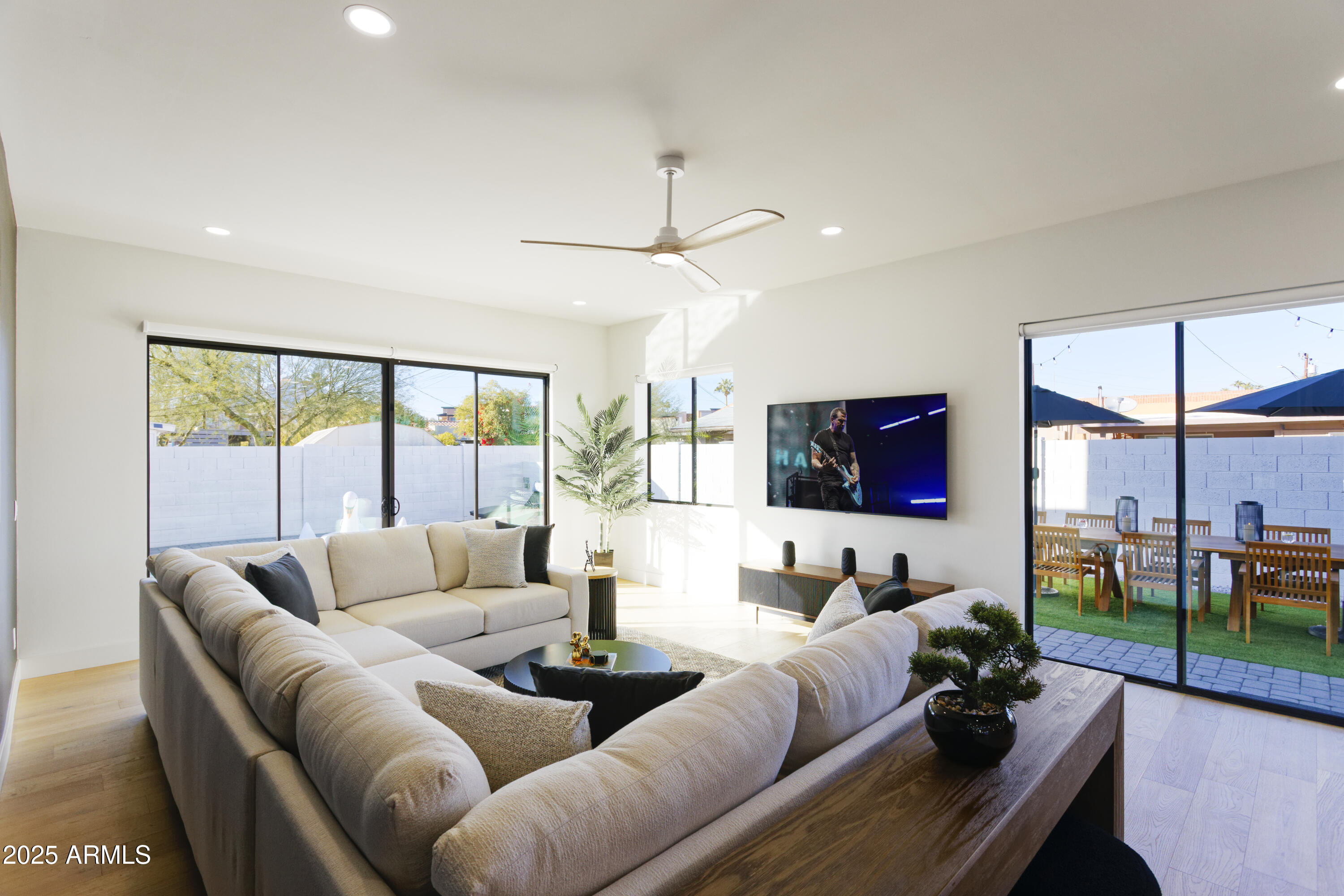 7520 East Highland Avenue Scottsdale, AZ 85251 - Photo 14 of 52 a living room with furniture and a flat screen tv