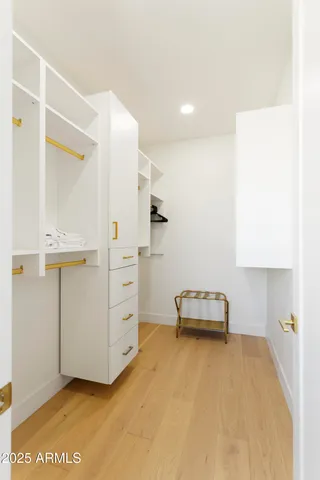 a bedroom with a bed and a cabinets