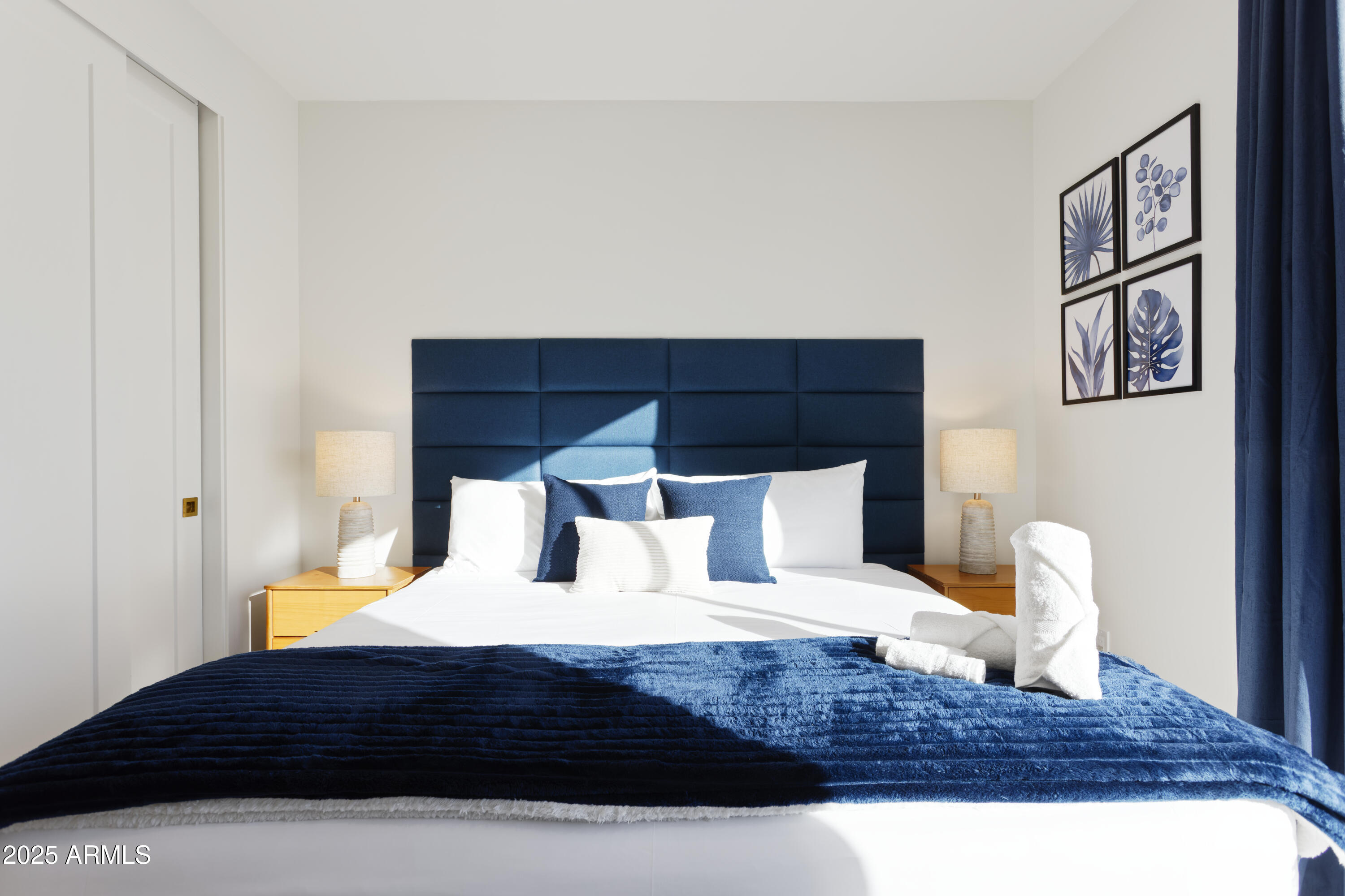 7520 East Highland Avenue Scottsdale, AZ 85251 - Photo 27 of 52 a bedroom with a large bed and a potted plant