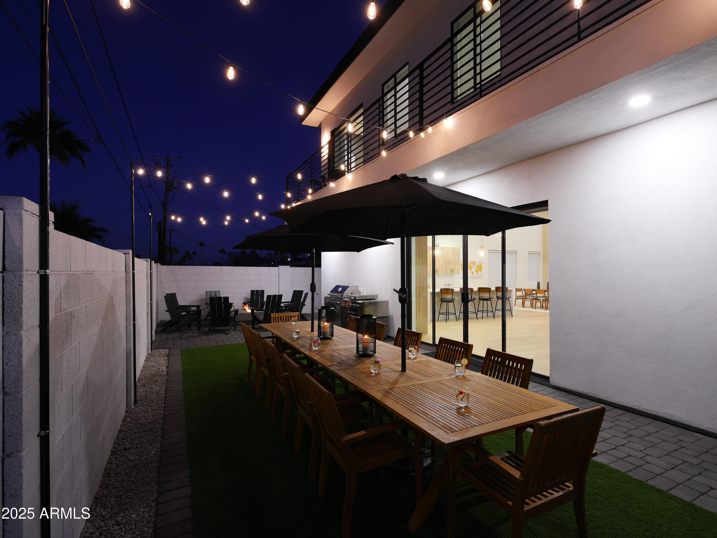 7520 East Highland Avenue Scottsdale, AZ 85251 - Photo 3 of 52 a kitchen with a sink stainless steel appliances and dining table