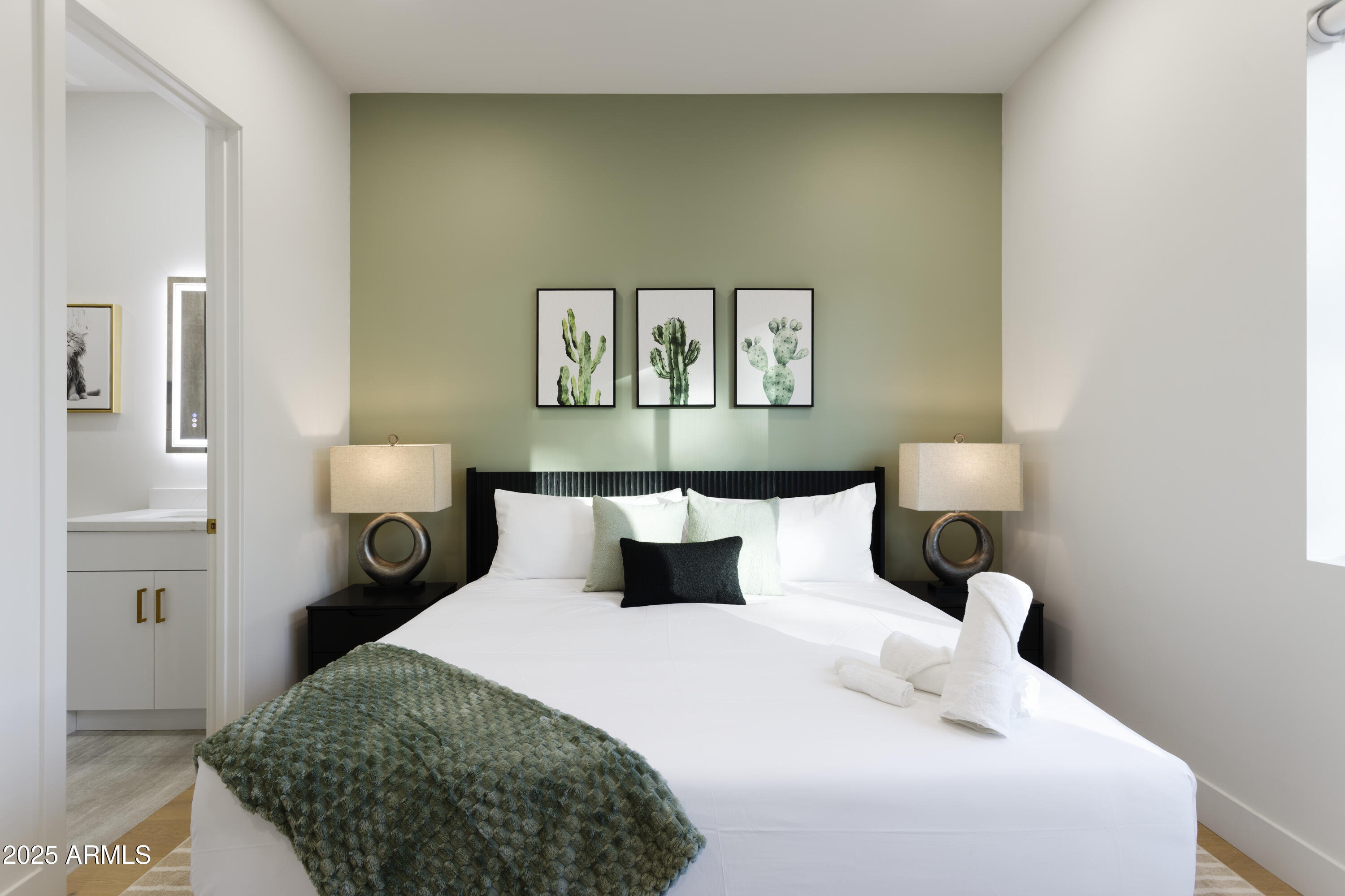 7520 East Highland Avenue Scottsdale, AZ 85251 - Photo 32 of 52 a bedroom with a bed and a painting on the wall