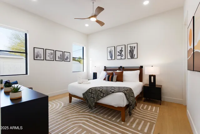 a bedroom with a bed and wooden floor