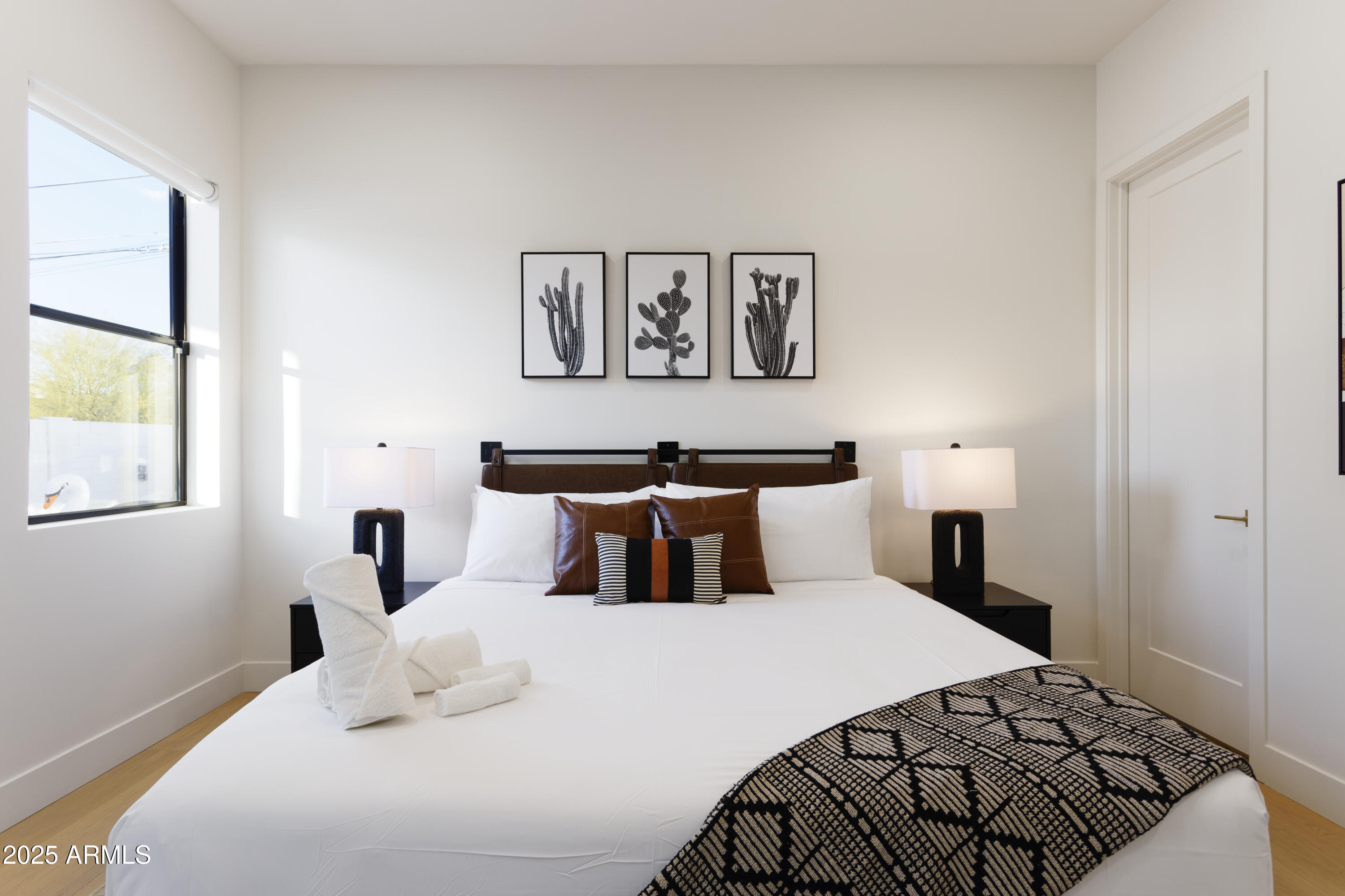 7520 East Highland Avenue Scottsdale, AZ 85251 - Photo 36 of 52 a bedroom with a large bed and a window