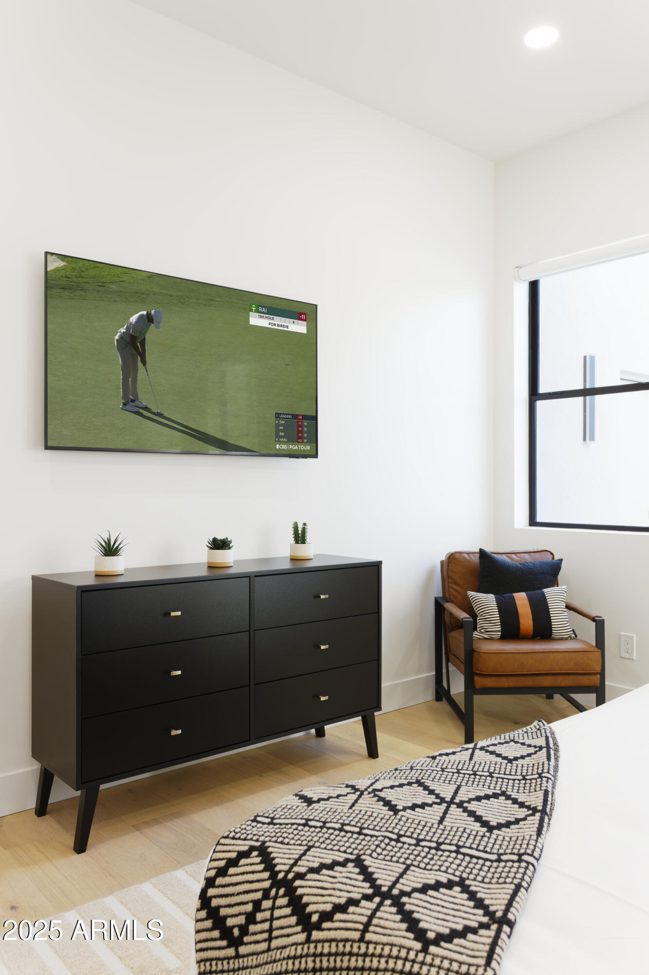 7520 East Highland Avenue Scottsdale, AZ 85251 - Photo 38 of 52 a living room with furniture and a flat screen tv