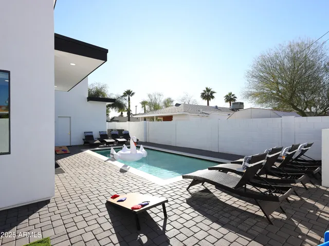 a kitchen with a sink and wooden cabinets