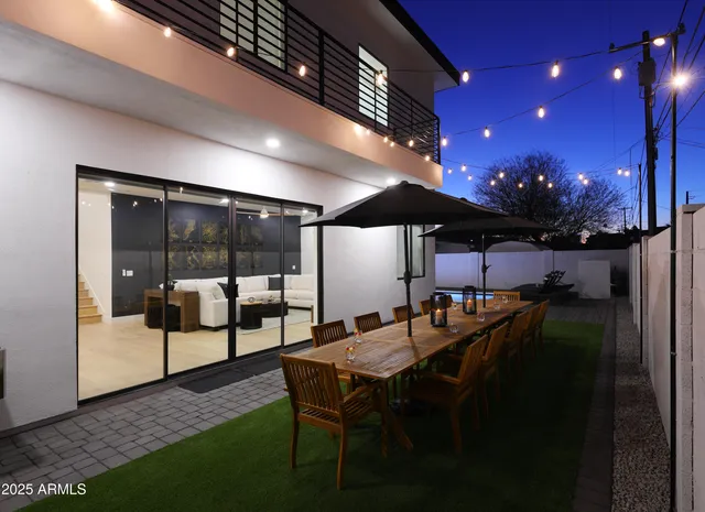 a view of a chairs and table in a patio