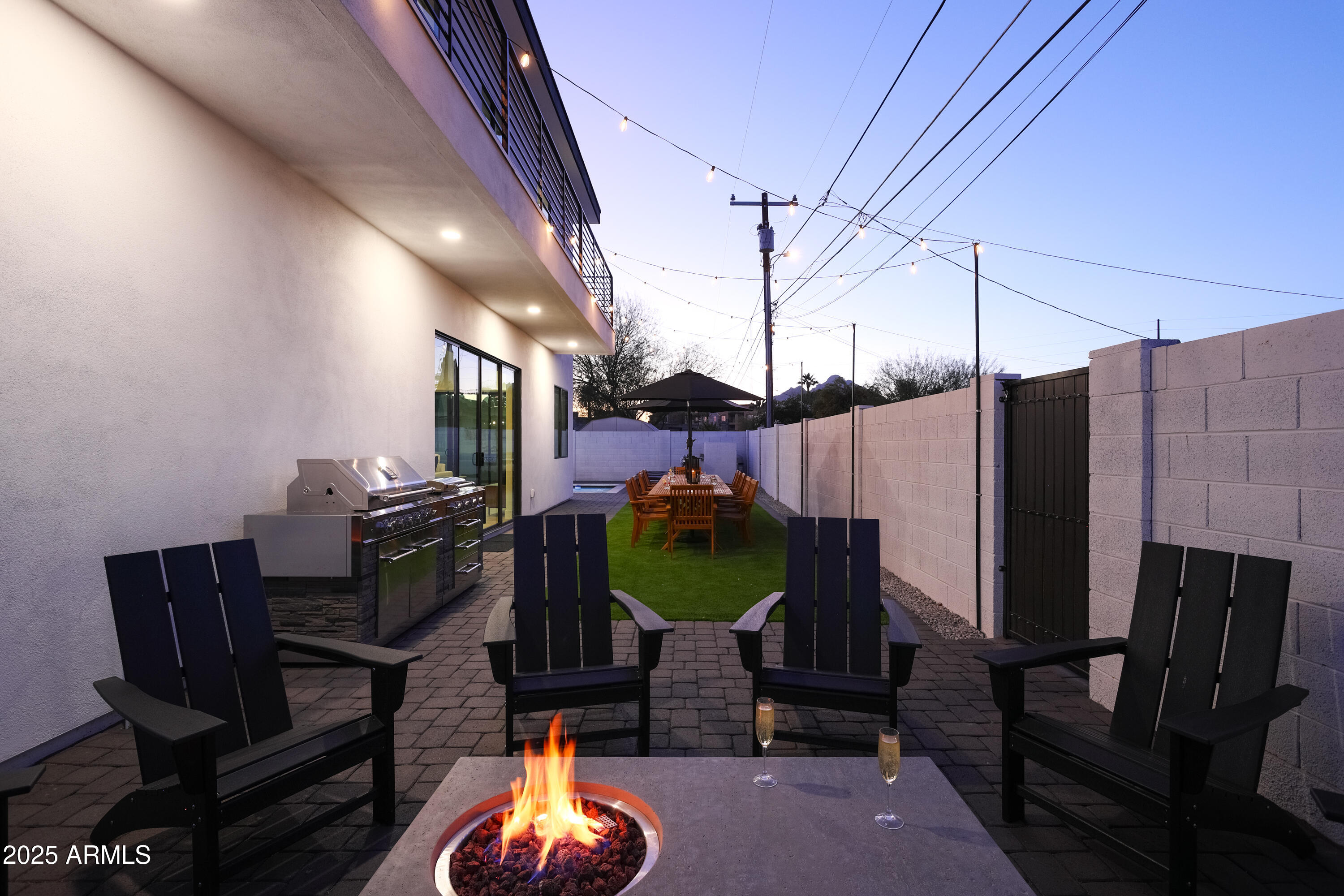 7520 East Highland Avenue Scottsdale, AZ 85251 - Photo 50 of 52 a view of a chairs and table in a patio