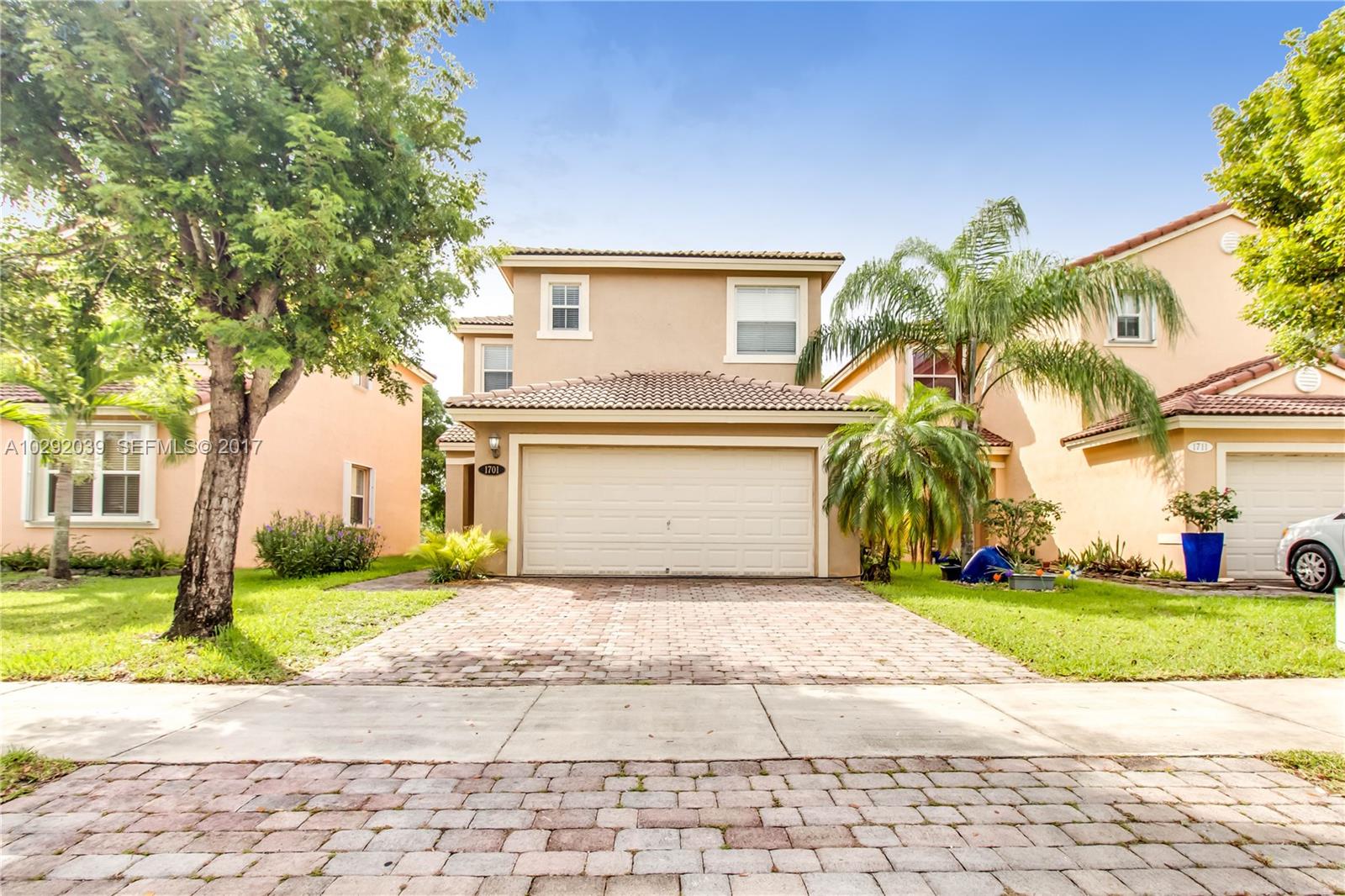 1701 Southeast 20th Road Homestead, FL 33035 - Photo 1 of 42 a view of a house with a yard and large tree