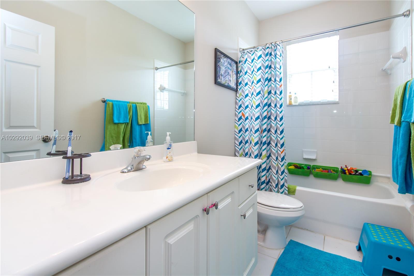 1701 Southeast 20th Road Homestead, FL 33035 - Photo 24 of 42 a bathroom with a sink toilet and a mirror