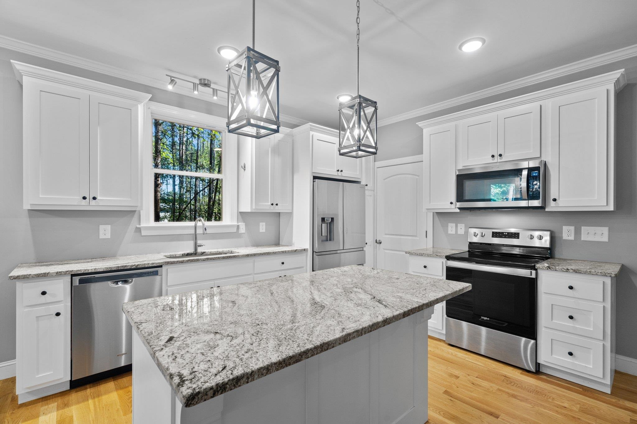 4539 Gresham Drive Oxford, NC 27565 - Photo 13 of 43 a kitchen with stainless steel appliances granite countertop a sink stove and refrigerator