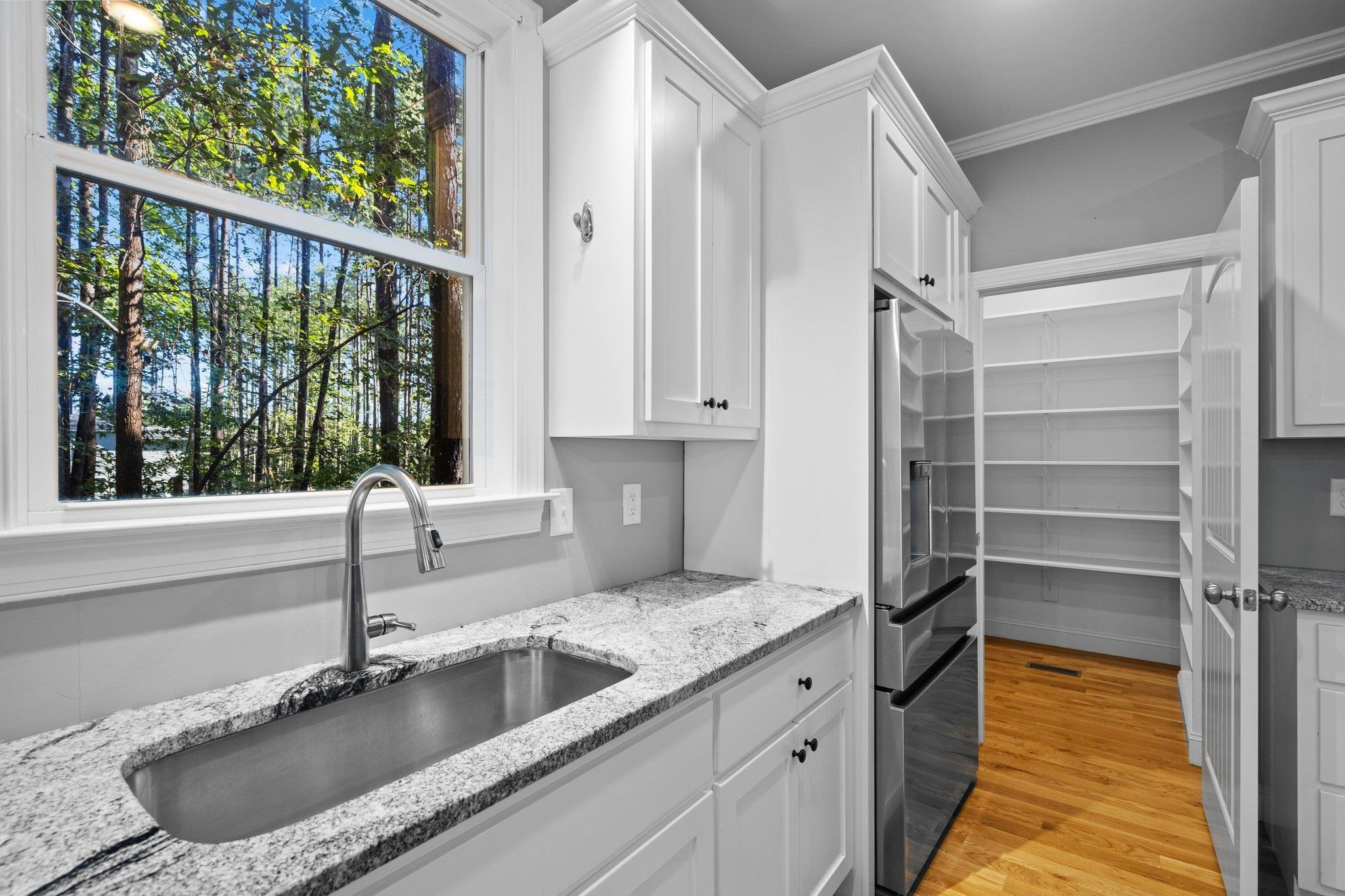 4539 Gresham Drive Oxford, NC 27565 - Photo 14 of 43 a kitchen with a sink and a large window