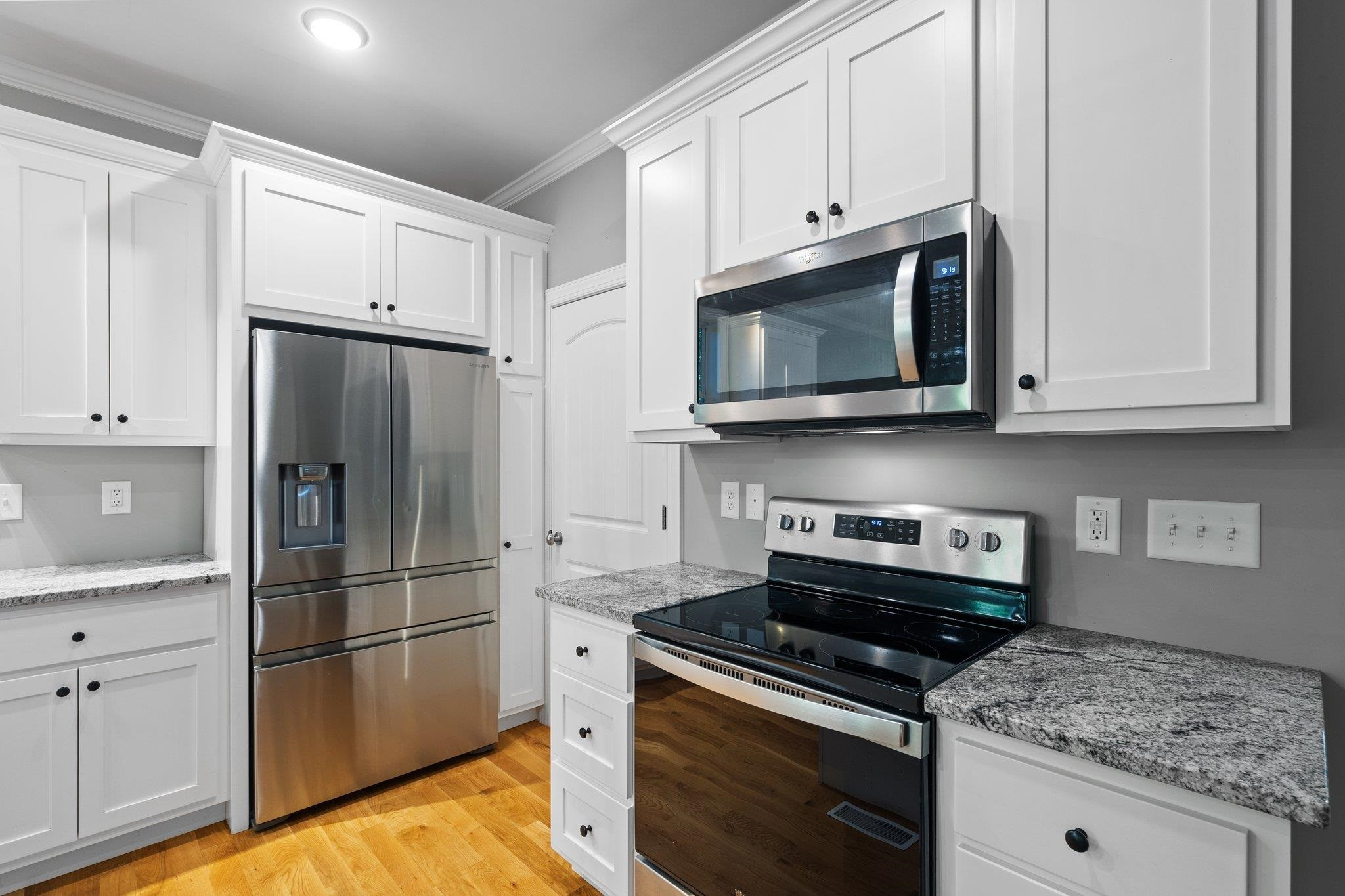 4539 Gresham Drive Oxford, NC 27565 - Photo 16 of 43 a kitchen with stainless steel appliances granite countertop a refrigerator stove and microwave