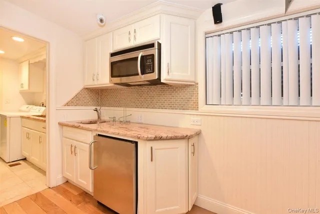 a kitchen with a stove and a microwave