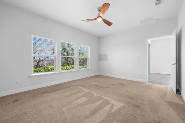 a view of an empty room with a window