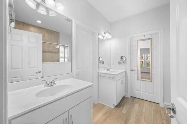 a bathroom with a sink double vanity and a mirror