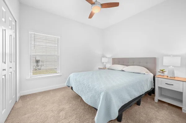 a bathroom with a sink a toilet and a large mirror