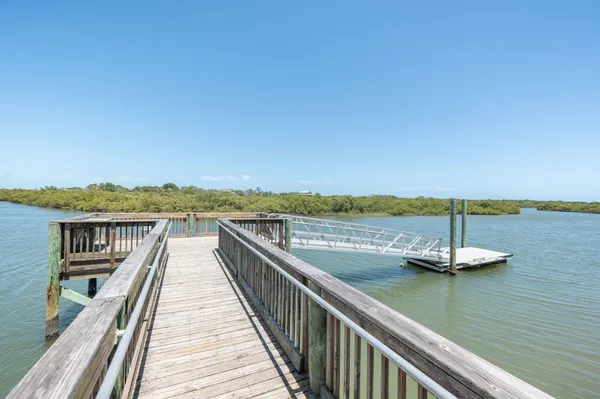 a view of a swimming pool with a lounge chair