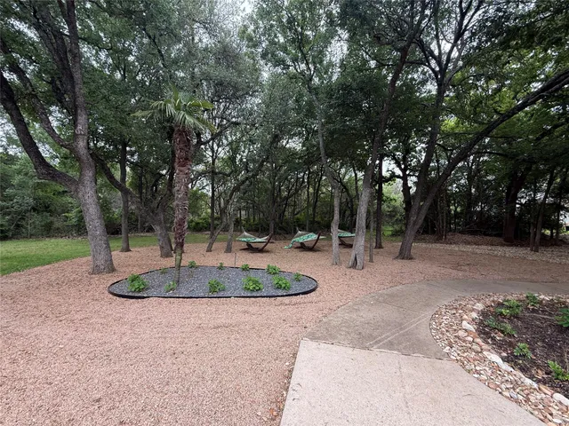 a backyard of a house with outdoor seating