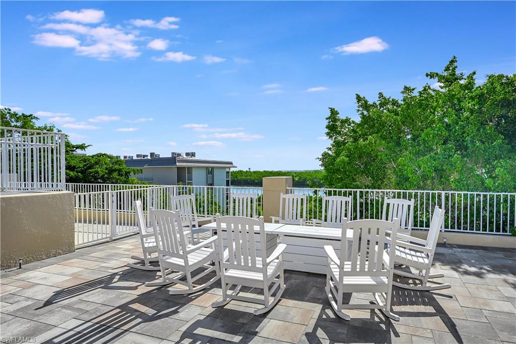 410 Bayfront Place, Unit 2409 Naples, FL 34102 - Photo 17 of 23 a view of a chair and tables