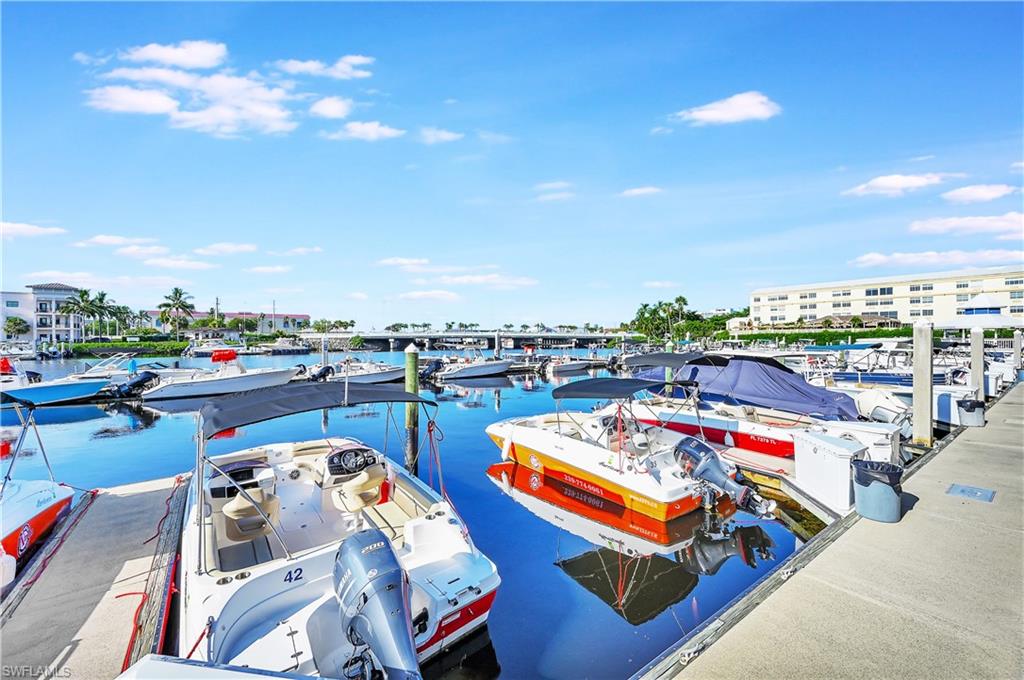 410 Bayfront Place, Unit 2409 Naples, FL 34102 - Photo 18 of 23 a blue and white water with a view of city