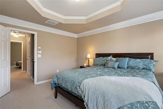 a bedroom with a bed and mirror