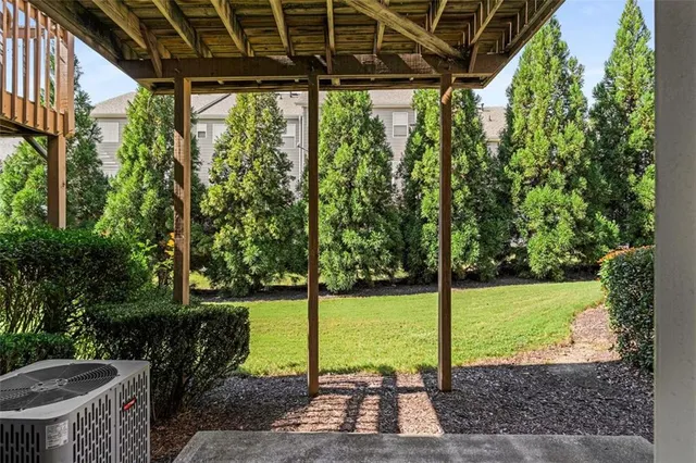 a view of a backyard with sitting area