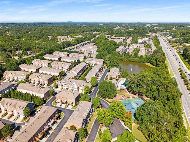 an aerial view of residential houses with outdoor space