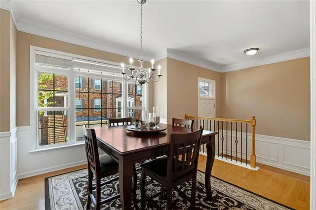 a view of a dining room with furniture window and wooden floor