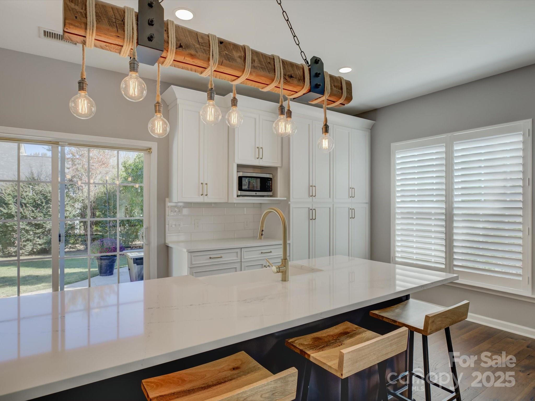 2125 Ashley River Road Waxhaw, NC 28173 - Photo 2 of 43 a view of a kitchen with a table and chairs