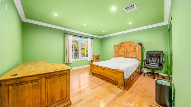 a bedroom with a bed and a dresser