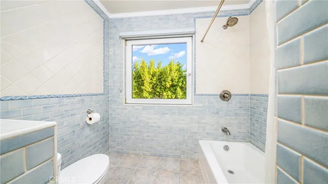 a bathroom with a sink a mirror and a shower