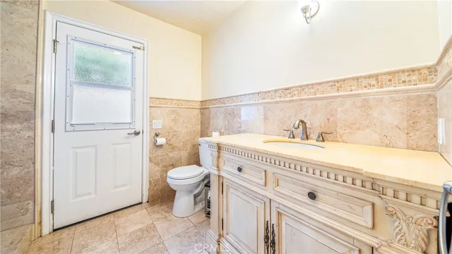 a bathroom with a glass shower door