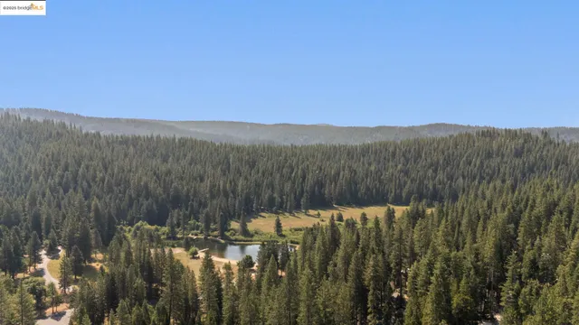 a view of a town with mountains in the background