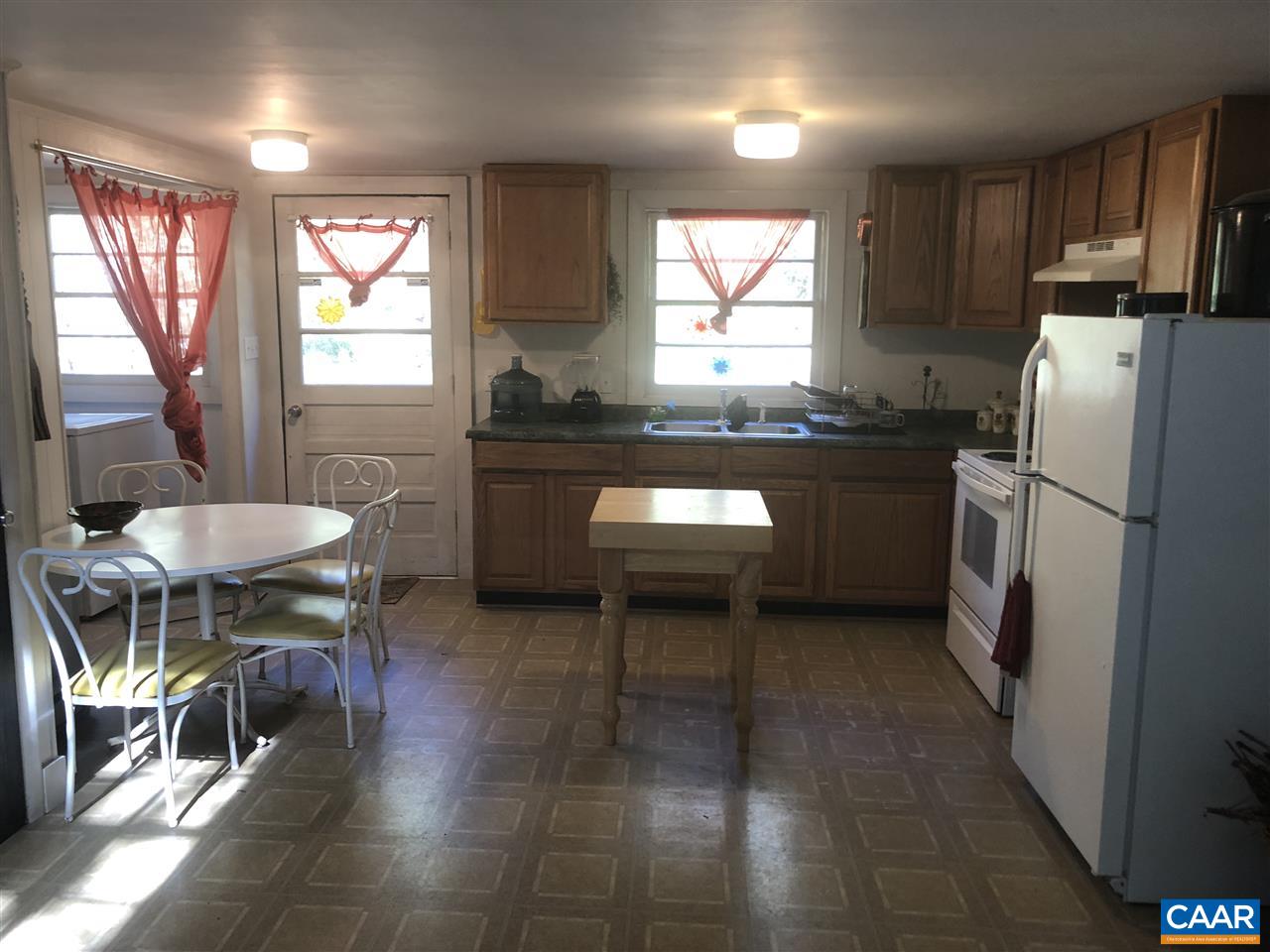 330 Rocky Road Stanardsville, VA 22973 - Photo 8 of 18 a kitchen with stainless steel appliances granite countertop a refrigerator a sink a stove and island