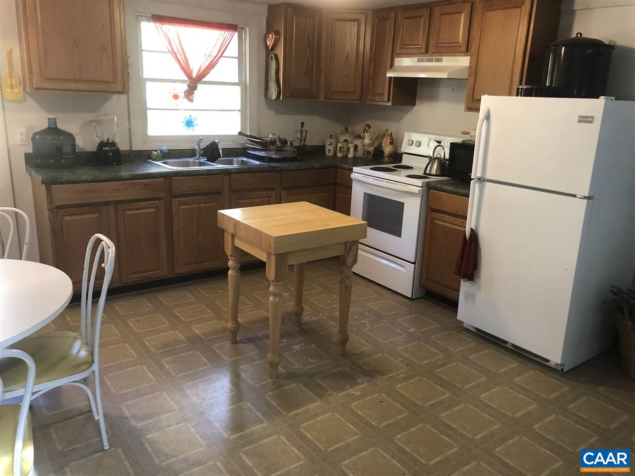 330 Rocky Road Stanardsville, VA 22973 - Photo 10 of 18 a kitchen with a sink a stove a refrigerator and cabinets