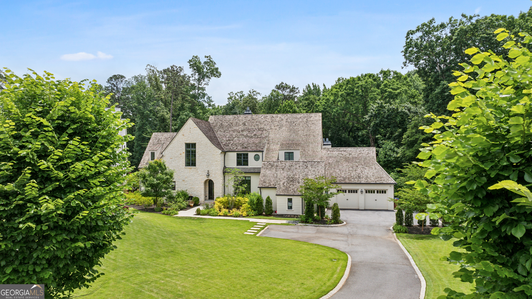 1734 Randall Mill Road Northwest Atlanta, GA 30327 - Photo 1 of 1 an aerial view of a house with swimming pool and garden