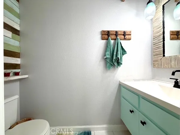 a bathroom with a double vanity sink mirror and shower
