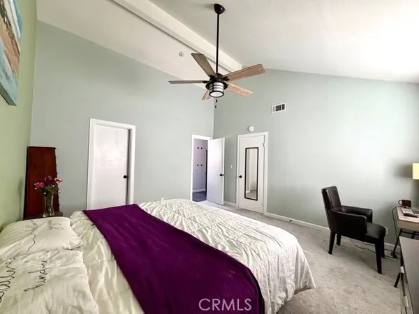 a spacious bathroom with a double vanity sink mirror and a bathtub