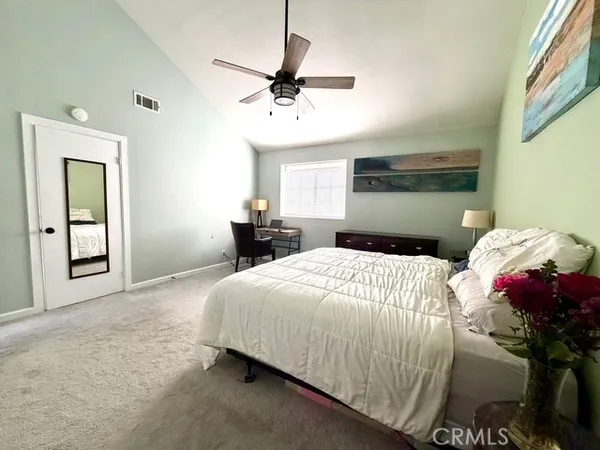 a spacious bathroom with a double vanity sink and a large mirror