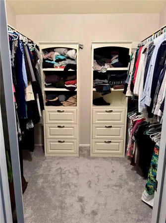 a bedroom with bed and a window