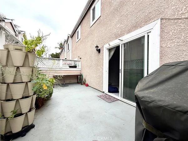 a kitchen with stainless steel appliances granite countertop a sink and white cabinets