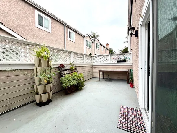 a view of a living room with furniture and a kitchen view