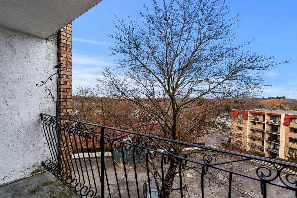 159 Franklin Street, Unit D2 Stoneham, MA 02180 - Photo 14 of 27 a view of a balcony with a pot