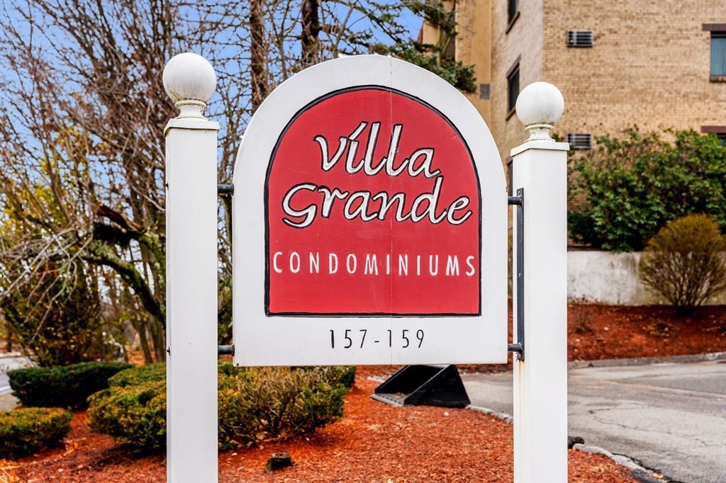 159 Franklin Street, Unit D2 Stoneham, MA 02180 - Photo 2 of 27 a sign board with a play ground in the back