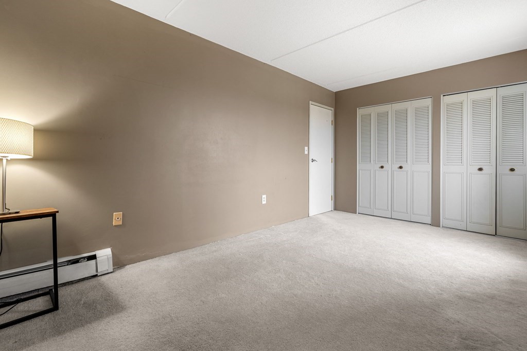 159 Franklin Street, Unit D2 Stoneham, MA 02180 - Photo 21 of 27 a view of an empty room and a window
