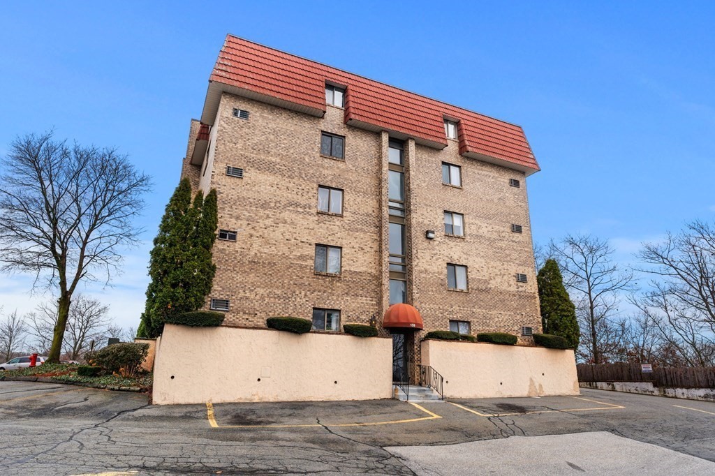 159 Franklin Street, Unit D2 Stoneham, MA 02180 - Photo 3 of 27 a front view of a house with a street