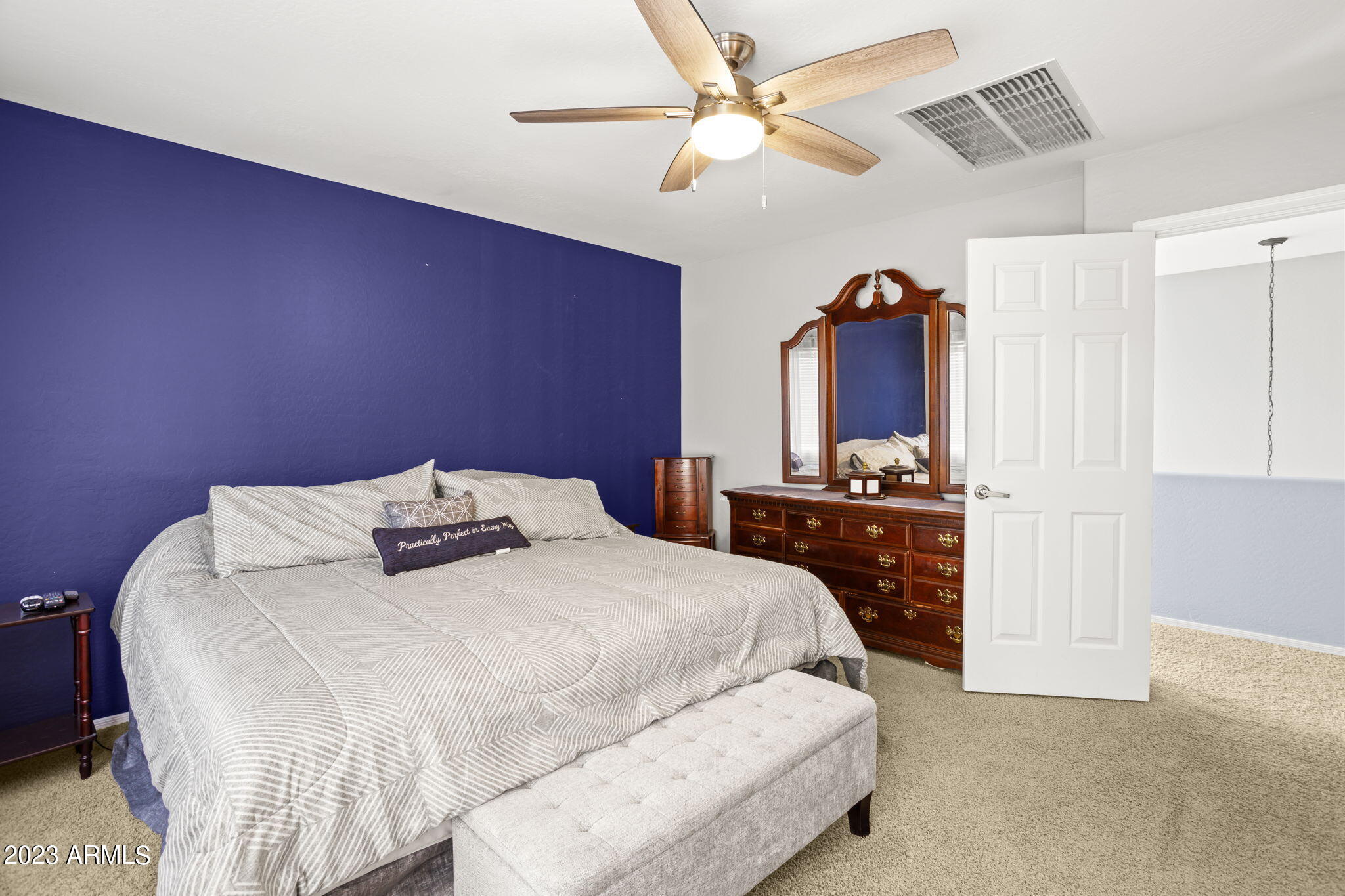3739 West Memorial Drive Anthem, AZ 85086 - Photo 12 of 23 a bedroom with a bed and a chandelier