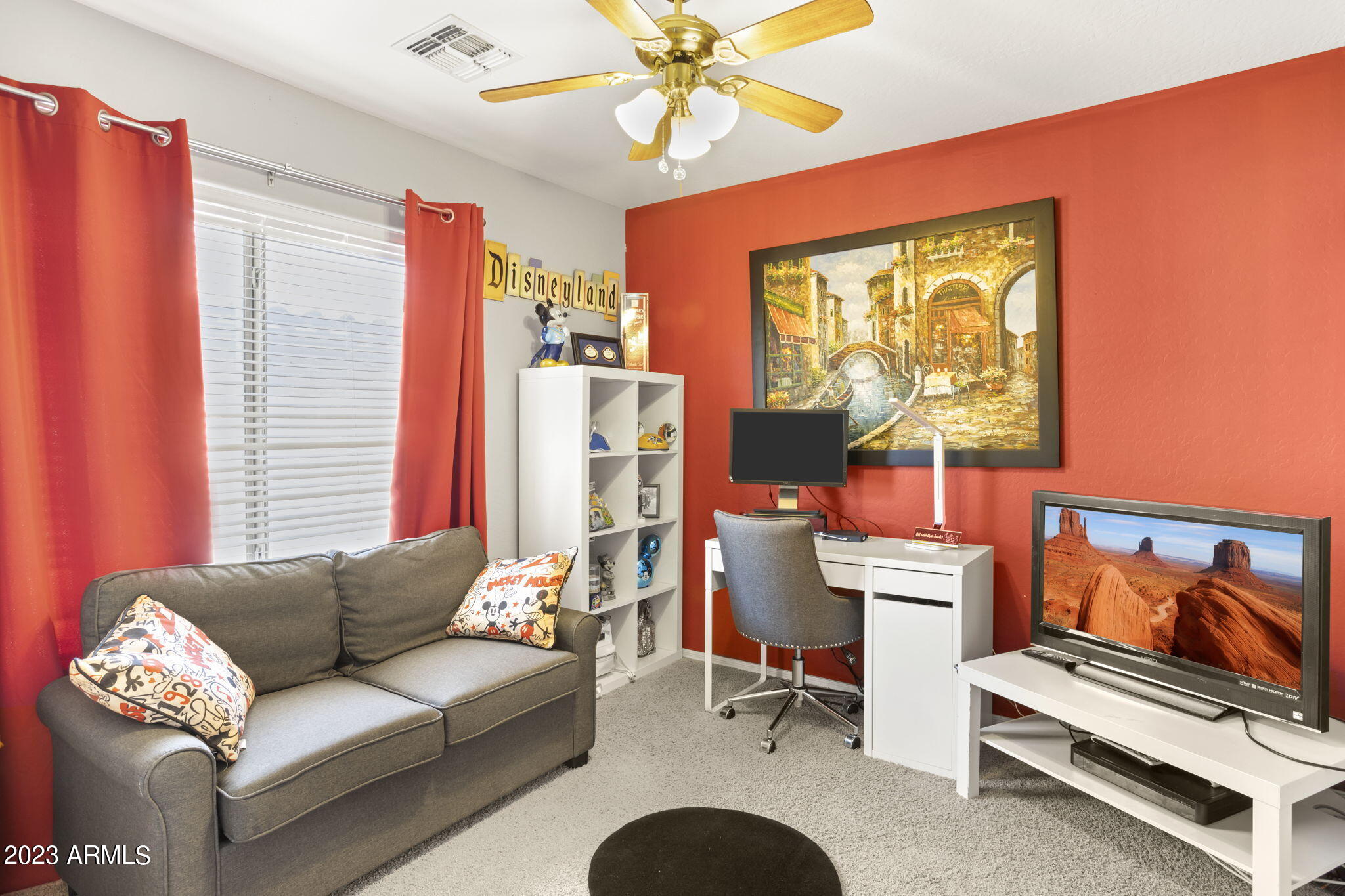 3739 West Memorial Drive Anthem, AZ 85086 - Photo 18 of 23 a living room with furniture a flat screen tv and a window