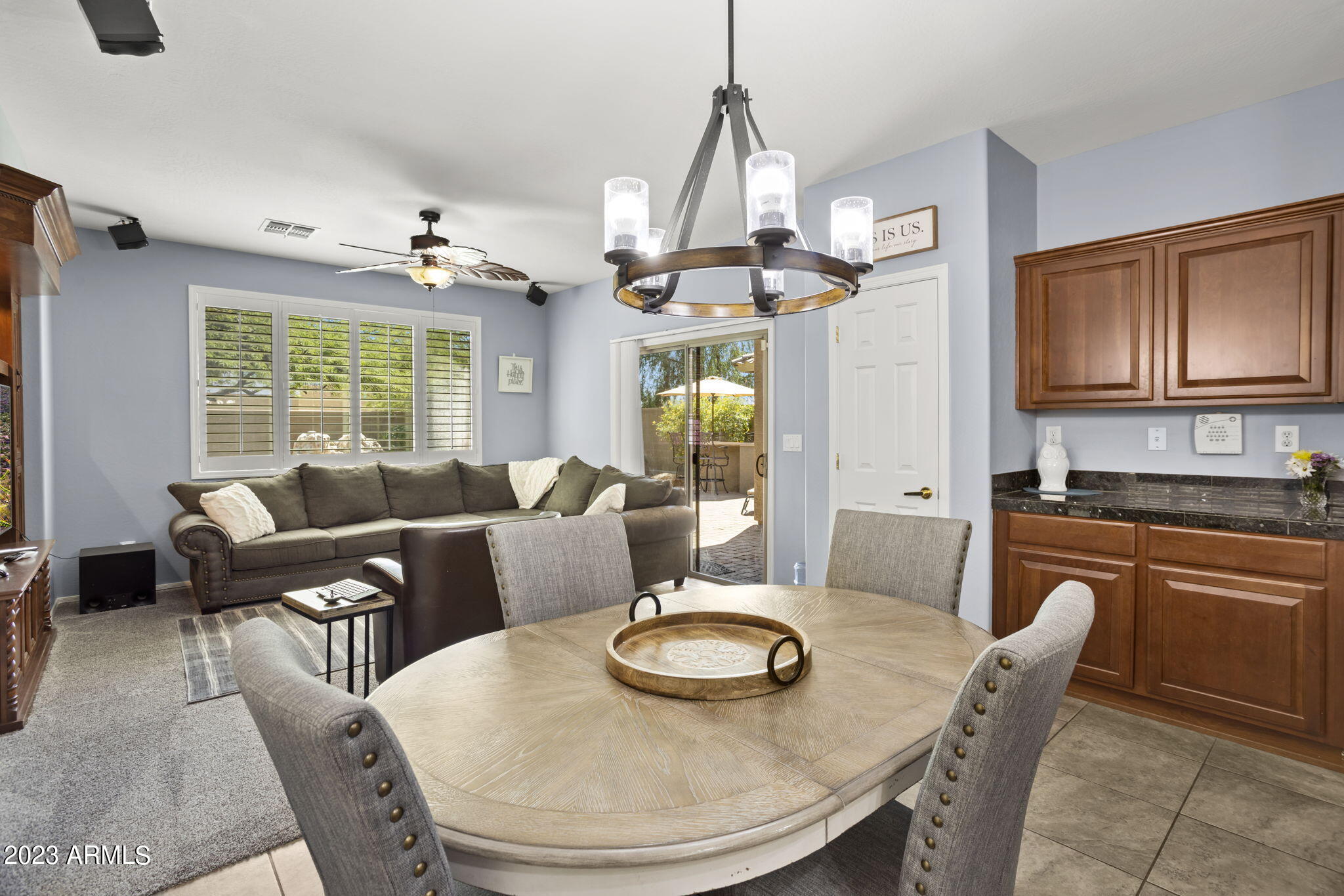3739 West Memorial Drive Anthem, AZ 85086 - Photo 6 of 23 a dining room with furniture a chandelier and window