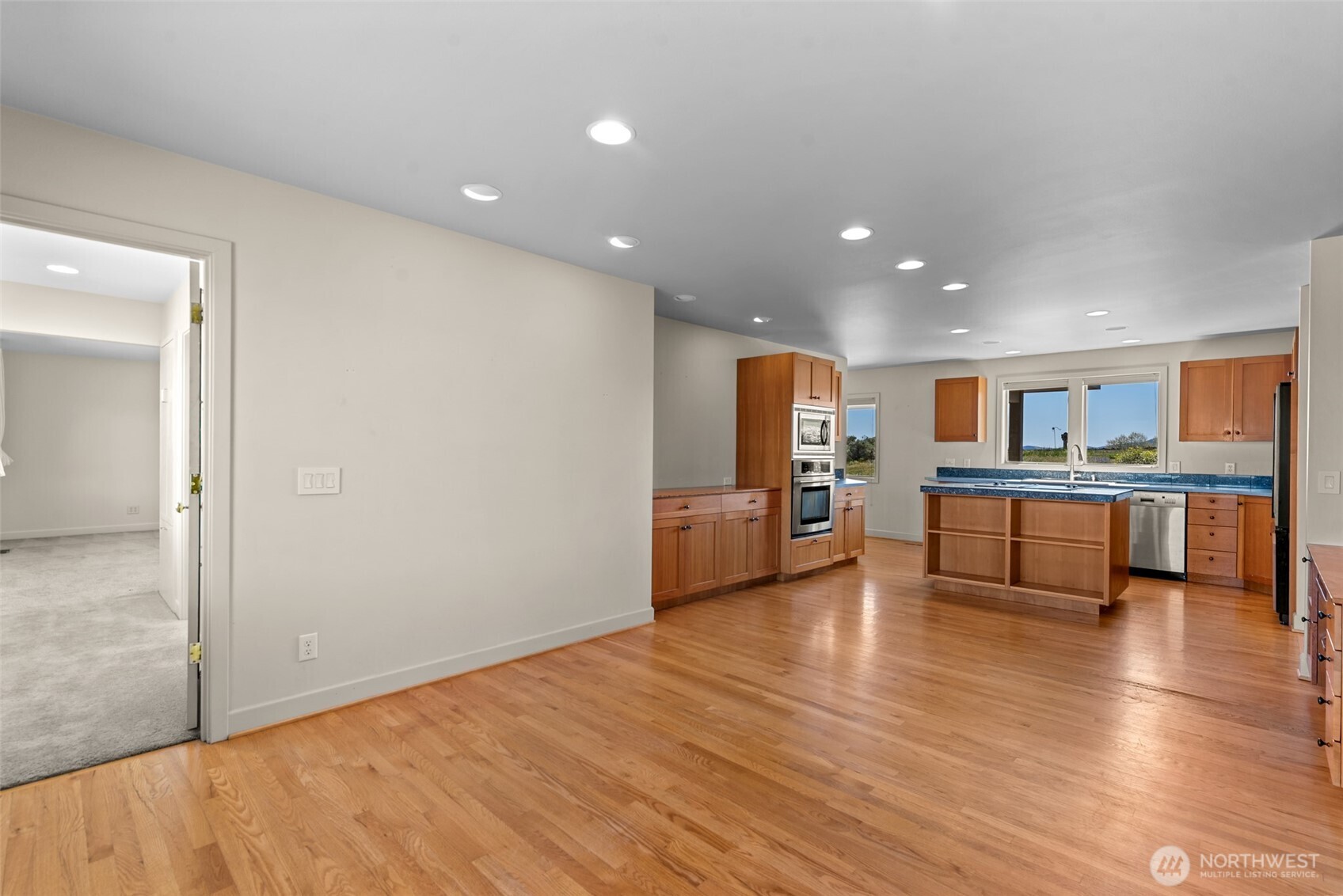 500 Connery Road Wenatchee, WA 98801 - Photo 13 of 39 a view of an empty room with kitchen and window